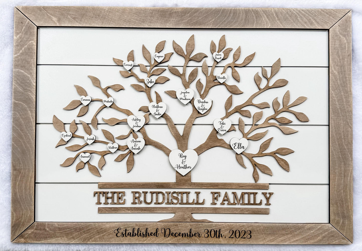 custom family tree sign with engraved family hearts on wooden shiplap wall art