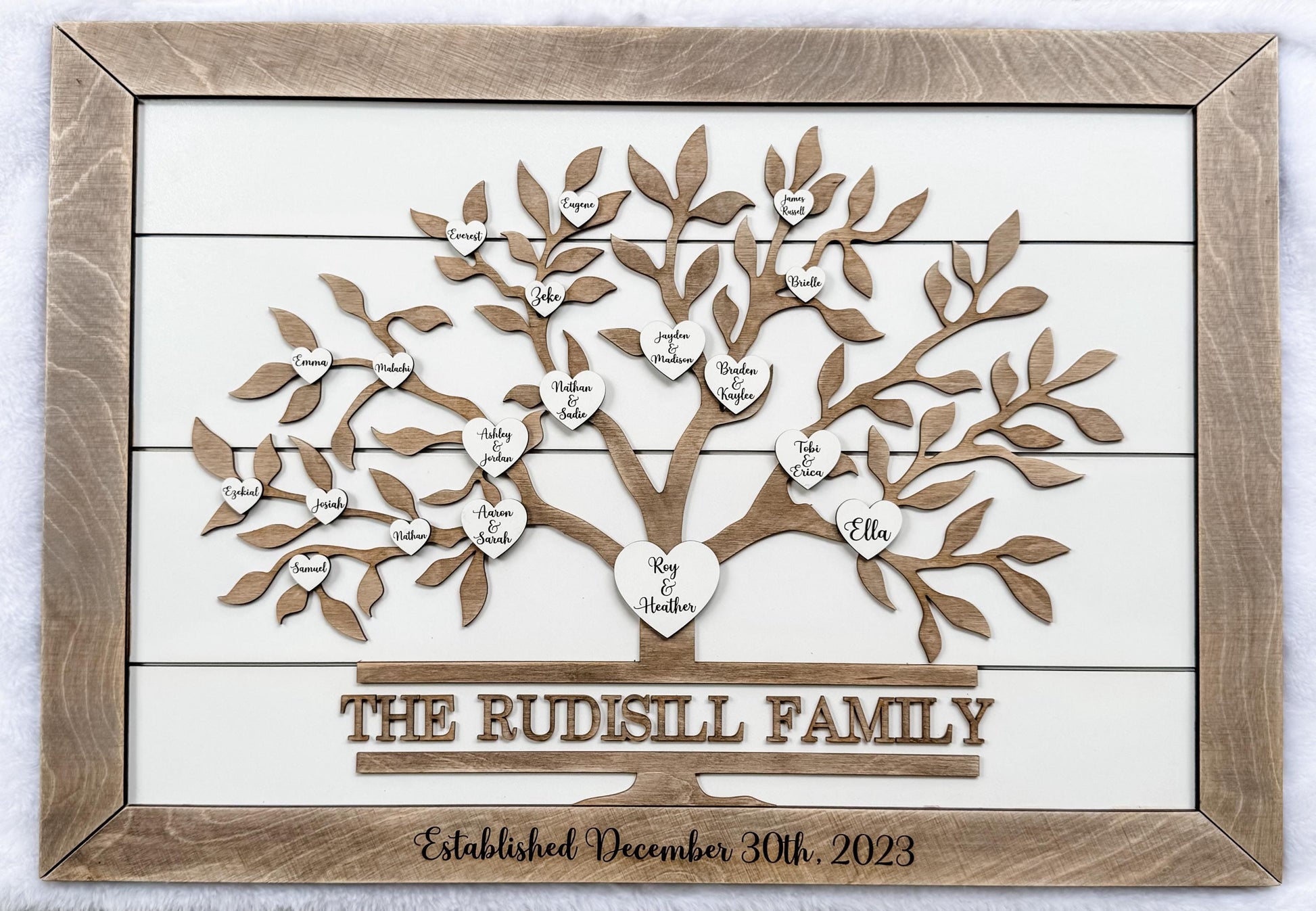 custom family tree sign with engraved family hearts on wooden shiplap wall art